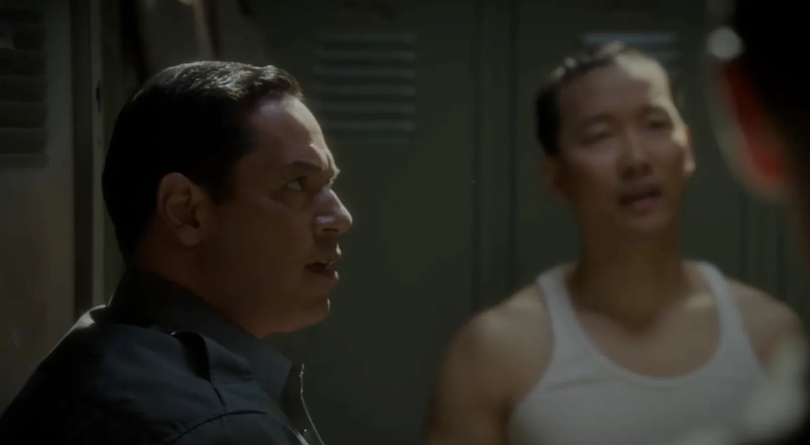 Agent Rick Ramirez Surprised by Carter in the Changing Room
