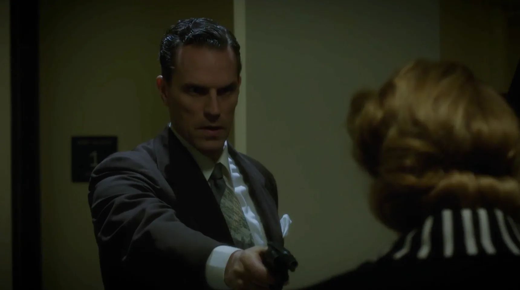 Agent Corcoran Holds Dottie At Gunpoint